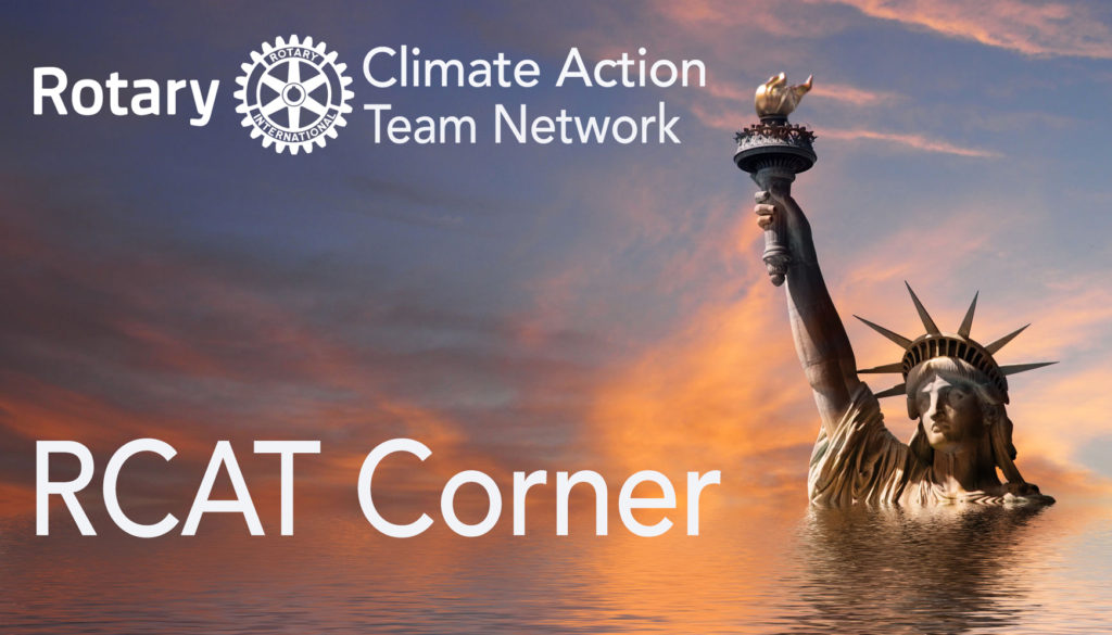 A statue of liberty in the middle of water with a climate action team logo.