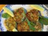 A plate of food with some fish cakes