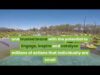 A picture of some water and trees with text.