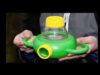 A person holding a green and yellow plastic container.