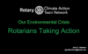 A black background with green text and the words " our environmental crisis "