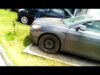 A car that has been knocked over by another car.